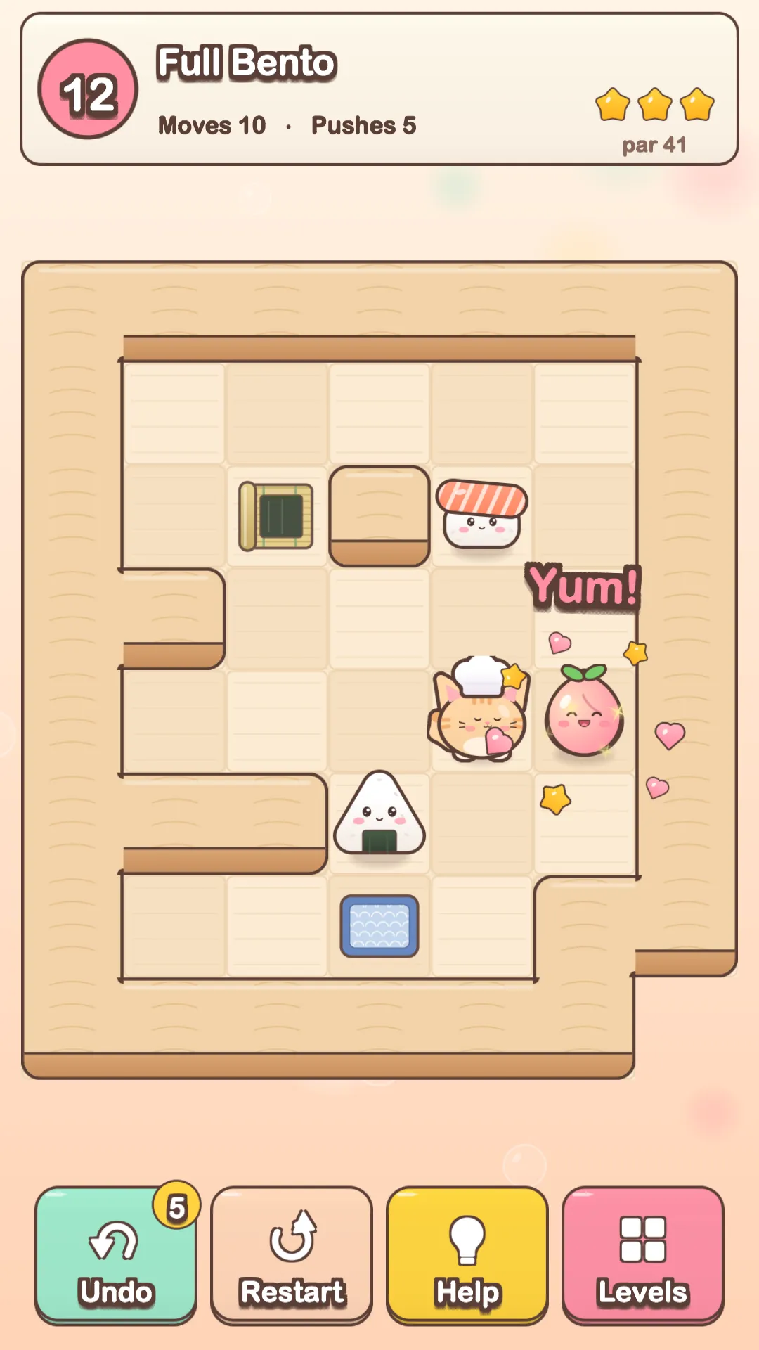 A Neko Bento level: the chef kitten pushes an onigiri, a sushi and a peach to their spots on a wooden table.