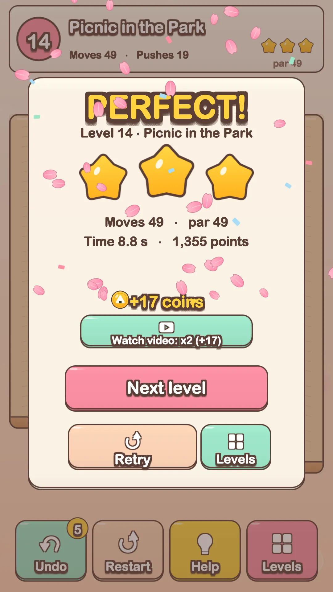 A perfect clear in Neko Bento: three stars, the level's moves, time and score, and falling sakura petals.